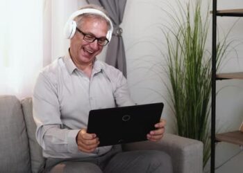 VideoHive Senior Technology Gaming Fun Man Playing on Tablet 42831733
