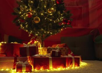 VideoHive The Magic of Christmas Wishes a Christmas Tree Decorated with Gifts Opens the Pages of the Christmas 47811873
